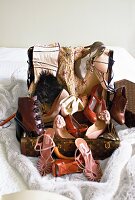 Various types of shoes in suitcase