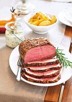 Roast beef with remoulade sauce and rosemary on plate