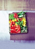 Various types of chillis on a tray