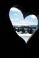 View of Hemsedal ski resort from heart in wooden door, Norway