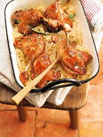 Roasted duck legs with Riesling and herb in baking tray