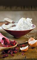 Beaten eggs in bowl with whisk for meringue