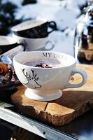 Hot chocolate in a cup with a stag motif