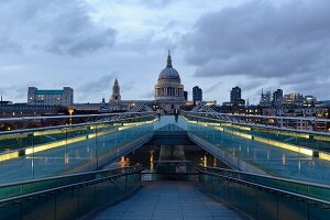 View of Millennium Bridge, Tate Modern and St Paul's Cathedral at dusk, London, UK