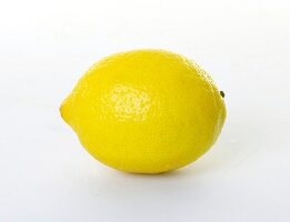 Whole lemon against white background