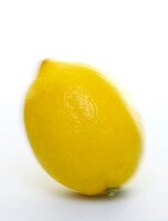 Whole lemon against white background