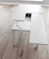 Resizing white dining table made of wood