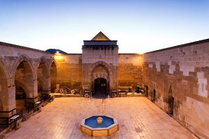 View of Sarihan caravanserai courtyard at dusk, Cappadocia, Turkey