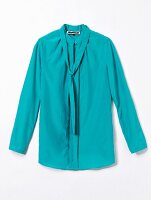 Close-up of turquoise sloop blouse on white background