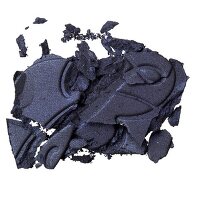 Close-up of black crumbled eye shadow on white background