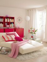 Living room in shades of red with sofa couch