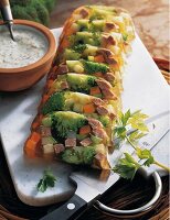 Italian style broccoli aspic with remoulade on chopping board