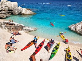 View of people and kayaks at Cala Mariolu, Gulf of Orosei, Sardinia, Italy