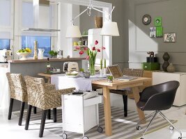 Dining area with dining table overlooking kitchen