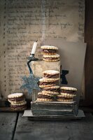 A stack of hazelnut sandwich biscuits with a chestnut filling