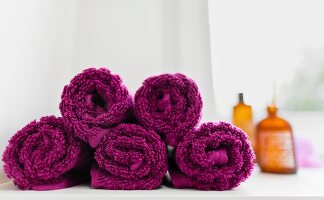 Close-up of rolled up pink towels