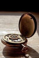 Close-up of gold pocket watch