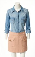 Denim shirt and mini skirt on mannequin on white background