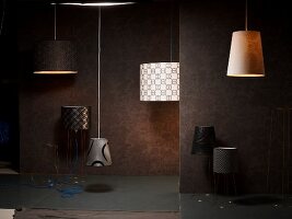 Illuminated ceiling and floor lamps from non-woven wallpaper