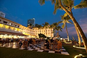 People dining on terrace of Galle Face Hotel, Colombo, Sri Lanka