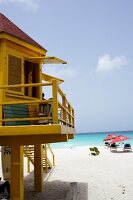 View of tourists and beach house on Lesser Antilles at Caribbean island, Barbados