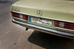 Close-up of license plate of old Mercedes 230 line 8,8 in green colour in Beirut, Lebanon