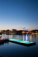 View of bathing ship pool on Spree river at dusk, Wrangelkiez, Berlin, Germany