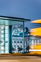 Illuminated Reichstag building at dusk, Berlin, Germany