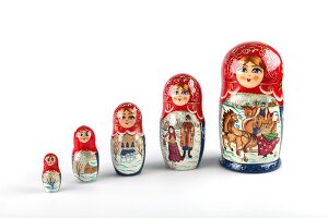 Colourful Russian dolls on white background