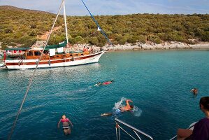People swimming in Mediterranean peninsula, Aegean, Turkey