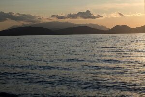 View of sea and mountain at dusk in Dilek Peninsula National Park, Turkey