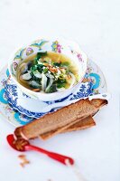 Spinach soup with fennel, feta and pine nuts