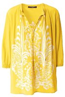 Yellow patterned tunic on white background