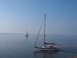 Sailboat in sea at Spiekeroog, Lower Saxony, Germany