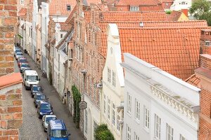 View of town library and cars parked on street, Lubeck, Schleswig Holstein, Germany