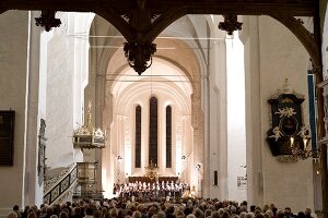 People in music festival at Lubeck Cathedral, Lubeck, Schleswig Holstein, Germany