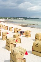 Hooded beach chairs at Gromitz beach in Schleswig Holstein, Germany