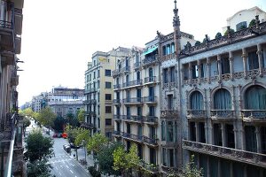 View of Sagrada Familia facade and street through building in Barceloan, Spain 