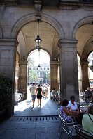 View of tourist walking and sitting in Placa Reial at Barcelona, Spain