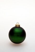 Close-up of green Christmas ball on white background