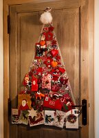 Various Christmas cards on wooden door with pin board