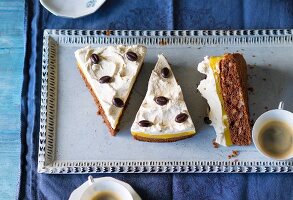 Orange and banana cake with cream and chocolate beans