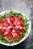 Rocket salad with grapefruit, tomatoes and pomegranate seeds