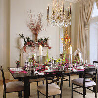 Set dining table, crystal chandelier and festive decorations