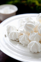 White meringue heaps on a plate