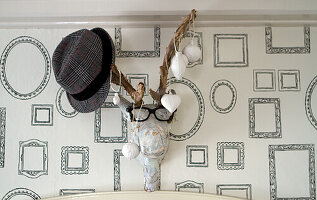 Wall decoration with hat, glasses and Christmas decorations