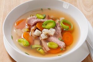 Beef stock with carrots, leek and meat