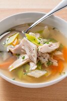 Clear soup with chicken and vegetables