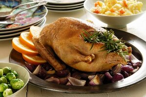 Roast duck with oranges and side of vegetables