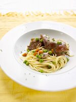 Rabbit with noodles, peas and carrots